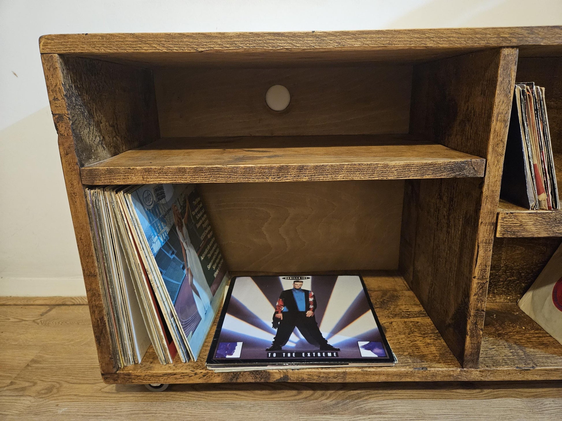 Vinyl record storage unit for albums and singles with space for amp and turntable