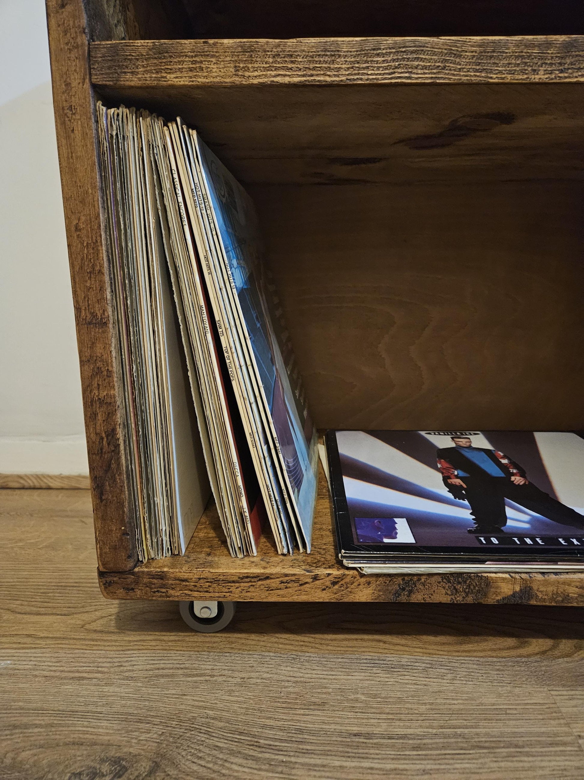 Vinyl record storage unit for albums and singles with space for amp and turntable